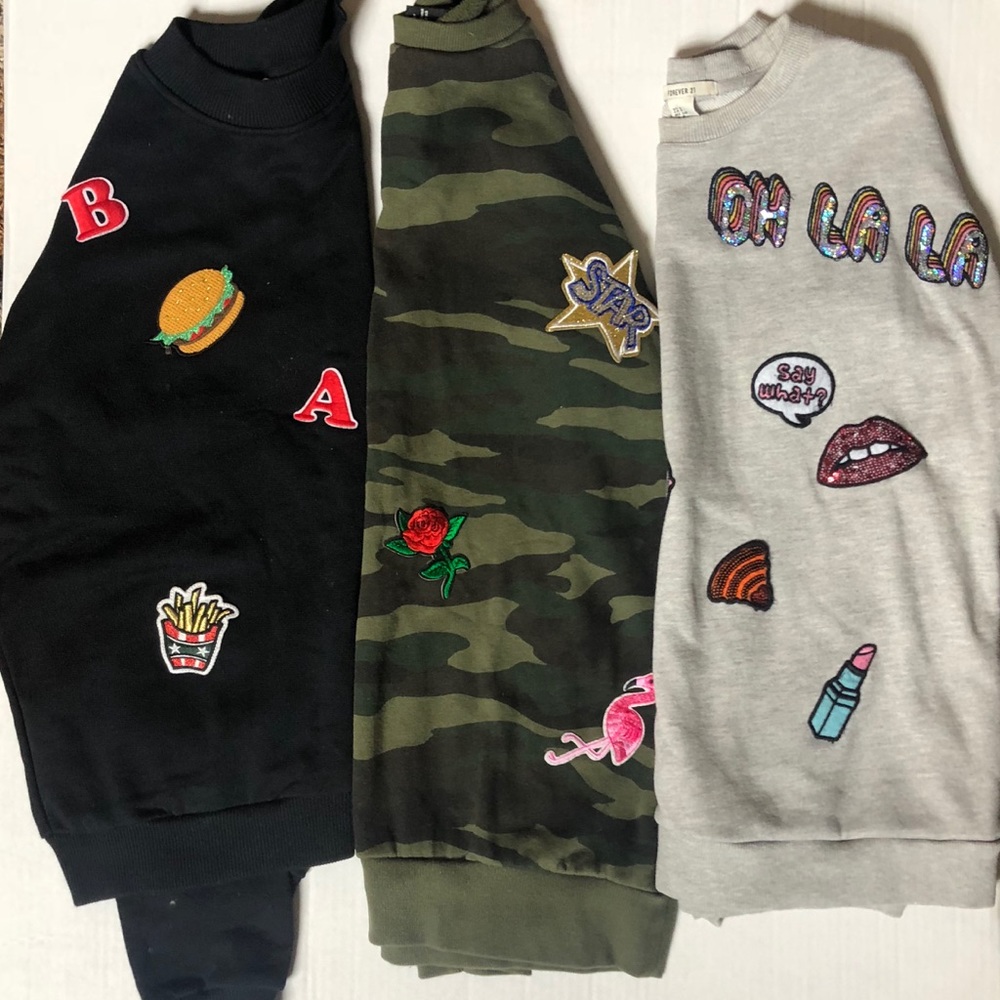 bundle of three patched sweatshirts